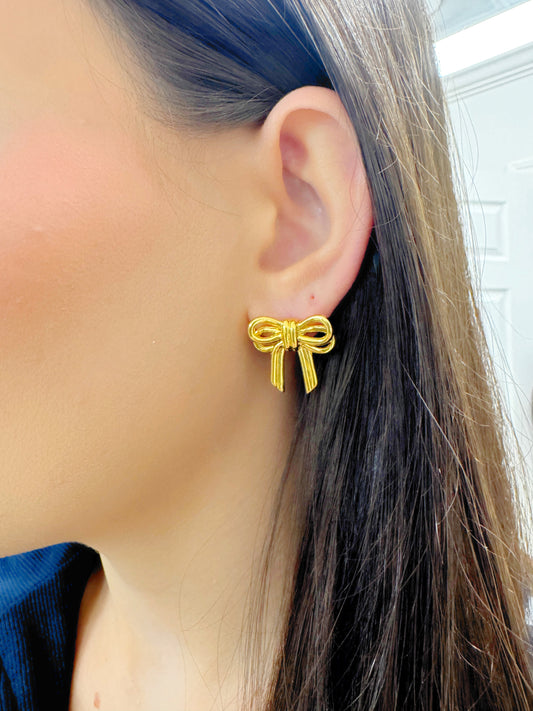 Gold bow-shaped earrings.